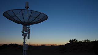Radio telescope dish at sunset